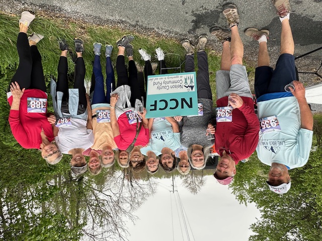 Group of smiling people at a 5K event